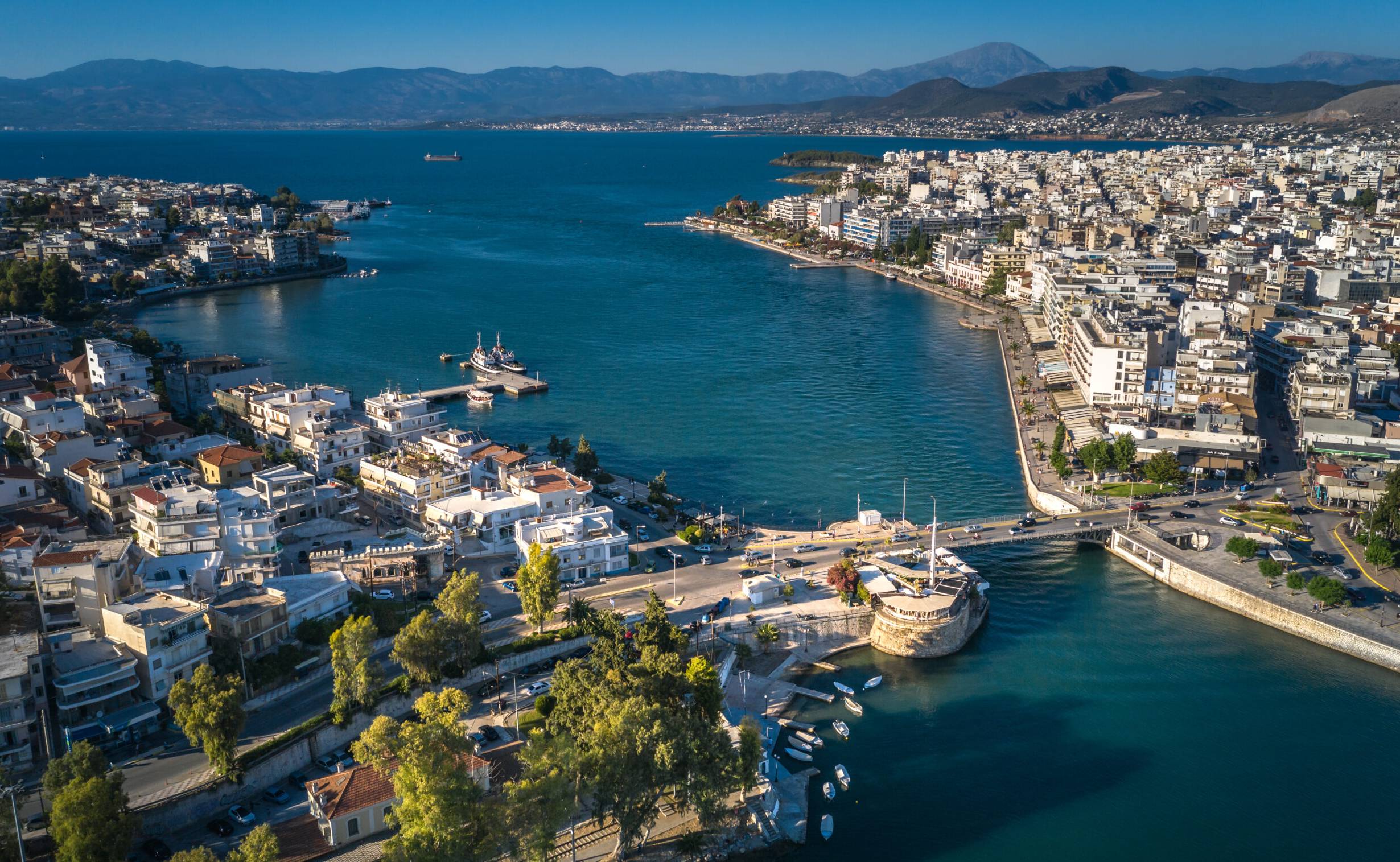 Aerial drone bird's eye view photo from famous city of Chalkida with clear water seascape and traditional character, Evia island, Greece